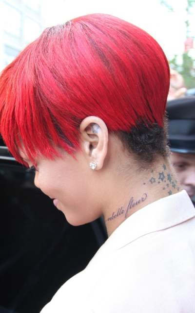 Rihanna gets new “Rebelle Fleur” tattoo