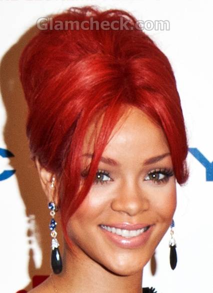 Singer Rihanna sports the fiery red top bun Hairstyle