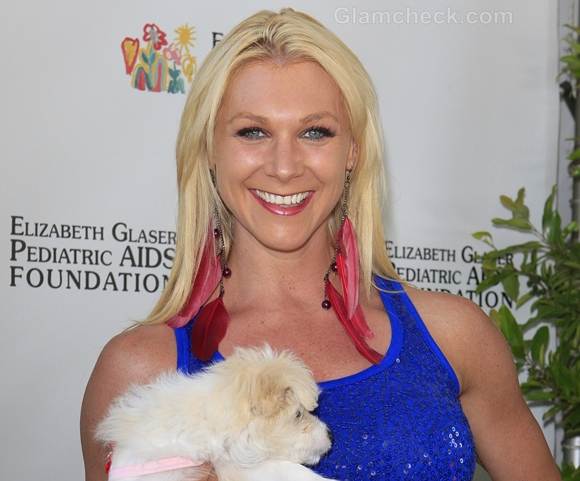 Jodi Tiahrt Sports Flirty Feather Earrings at Celeb Picnic